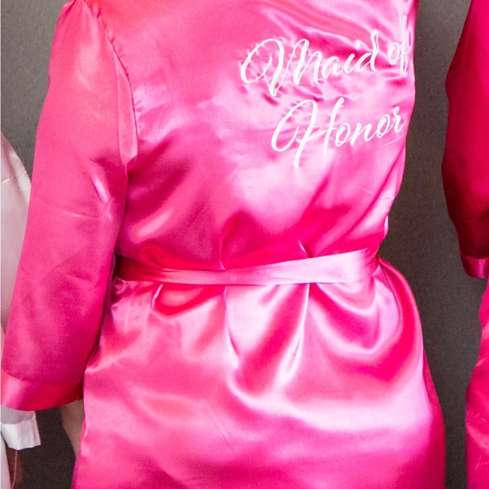 Maid of honor robe. Pink with white writing. Size large. New.